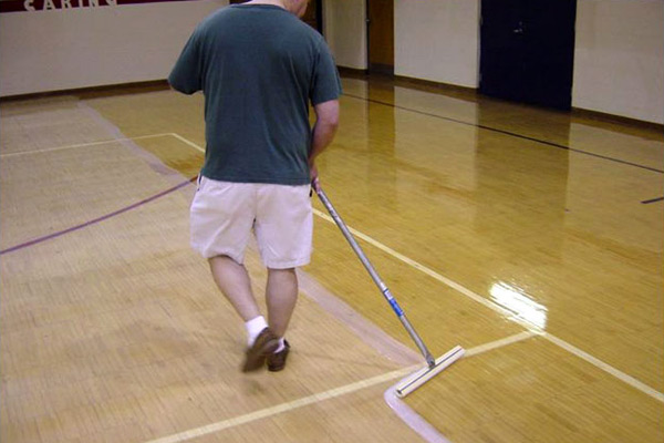 Padco Floor Finish Applicator on a gym floor