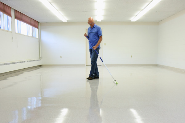 Padco Floor Coater applying wax to vinyl floor